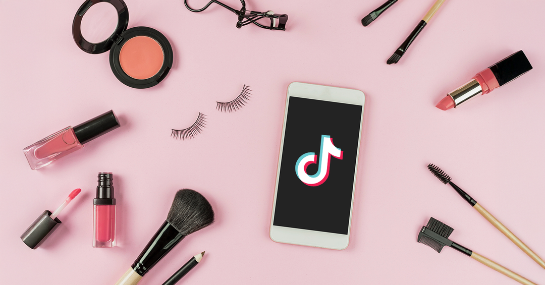 Makeup products surround TikTok, representing eCommerce beauty brands advertising on TikTok