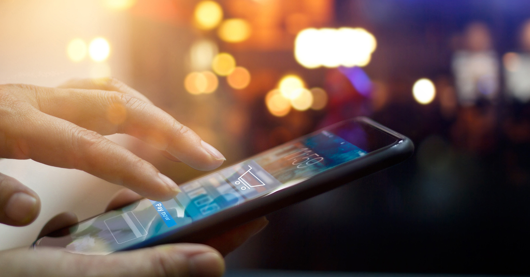 Person making an online purchase in a fast-paced digital world