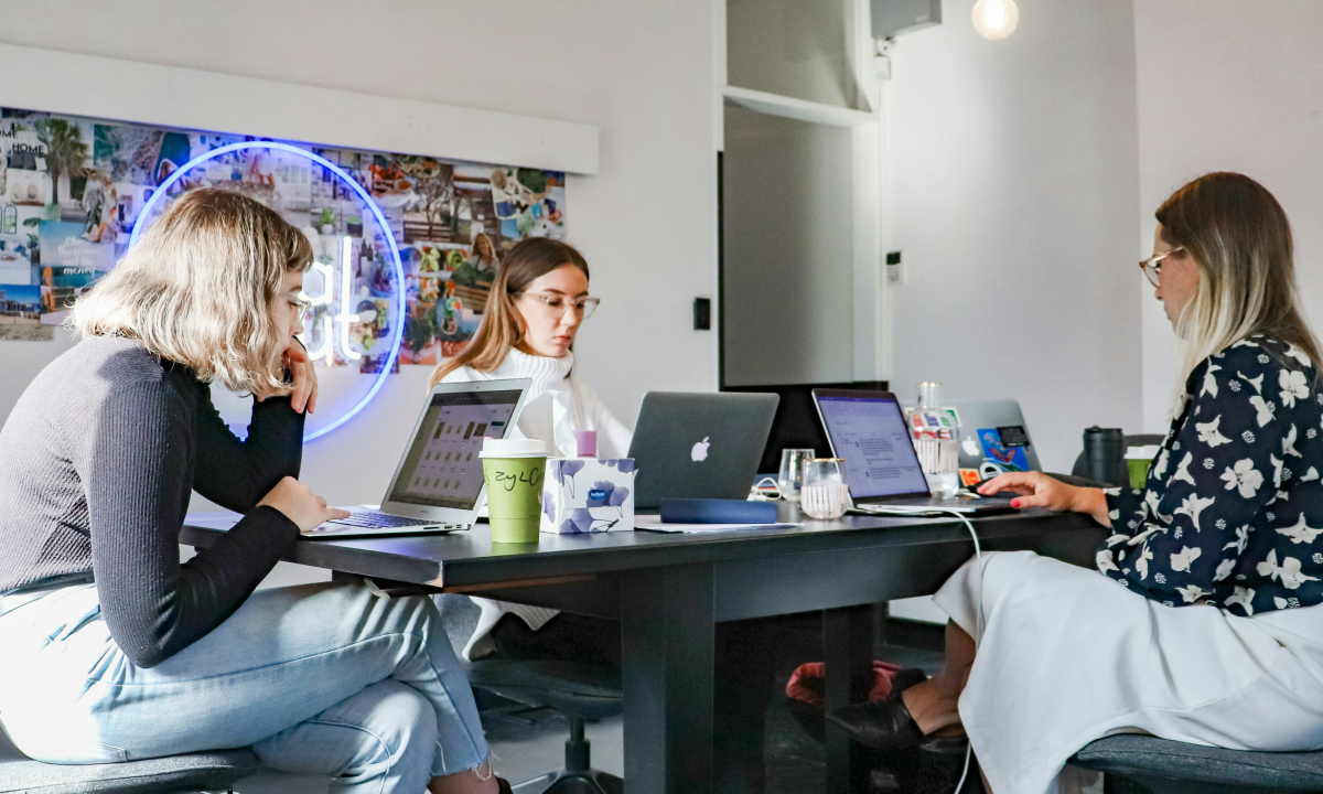 Professional examining marketing performance data related to customer acquisition and audience growth, representing the need to scale by reaching new buyers rather than recycling existing customers.